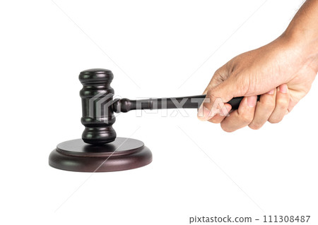 Hand holding wooden judge gavel isolated on white background for judgment and justice concept. 111308487