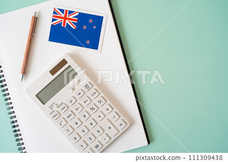 New Zealand flag, calculator, notebook and pen New Zealand flag, calculator, notebook and pen 111309438