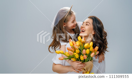 Daughter and mother with bouquet of flowers Daughter and mother with bouquet of flowers 111309555