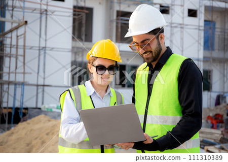Team of architect or engineer looking laptop for inspection and planning construction. 111310389