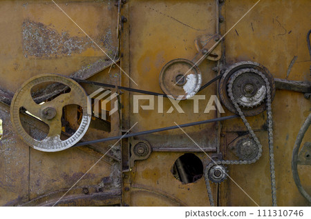 Old rusty agricultural machinery. Close-up Of Abandoned harvester, tractor Old rusty agricultural machinery. Close-up Of Abandoned harvester, tractor 111310746