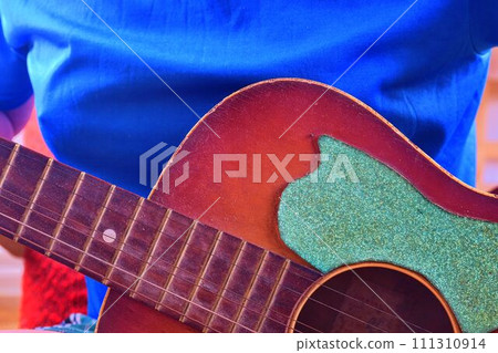 Man playing acoustic guitar. Musical concept. Close-up. 111310914