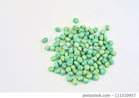 Dried pea seeds ready to plant. Close-up on a white background Dried pea seeds ready to plant. Close-up on a white background 111310957