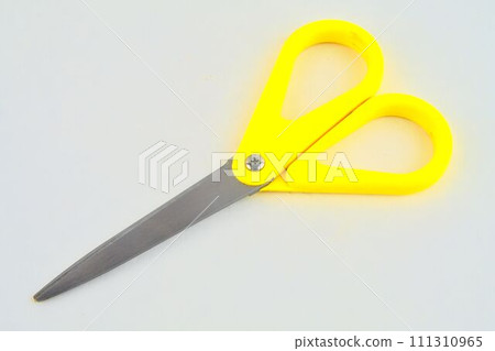 Yellow scissors isolated on a white background. Top view Yellow scissors isolated on a white background. Top view 111310965