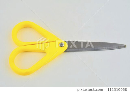 Yellow scissors isolated on a white background. Top view Yellow scissors isolated on a white background. Top view 111310968
