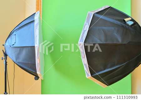 Empty photo studio with lighting equipment. Green background in photo studio 111310993
