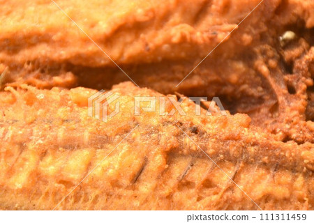 deep fried black-banded trevally fish on plate dipping spicy chili sauce   111311459