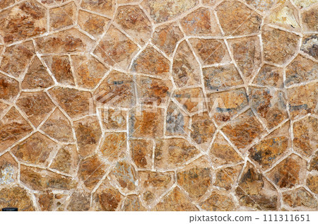 Texture of old irregular shaped tiles made of stones. Road tiles of different sizes as a background. Texture of old irregular shaped tiles made of stones. Road tiles of different sizes as a background. 111311651