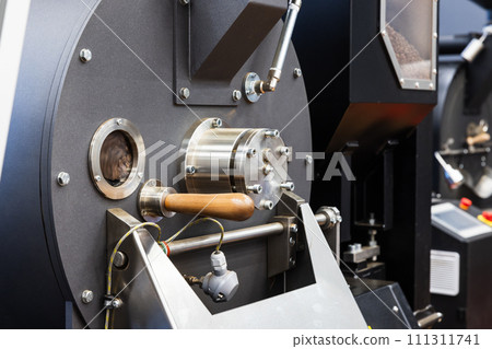 Industrial coffee roaster close-up photo, roastery of specialty coffee Industrial coffee roaster close-up photo, roastery of specialty coffee 111311741