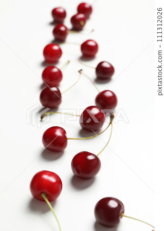 Ripe juicy cherry fruits on a white background 111312026