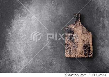 Empty wooden cutting board on a light texture background 111312581
