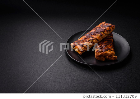 Delicious crispy sweet puff pastry with chocolate and salted caramel 111312709