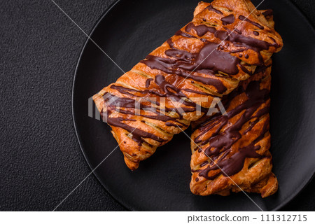 Delicious crispy sweet puff pastry with chocolate and salted caramel 111312715