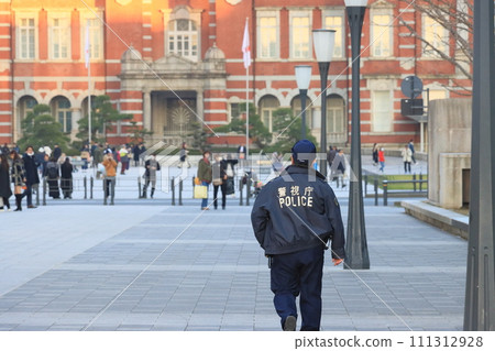 Police officers guarding the area around Tokyo Station; Metropolitan Police Department police officers Police officers guarding the area around Tokyo Station; Metropolitan Police Department police officers 111312928