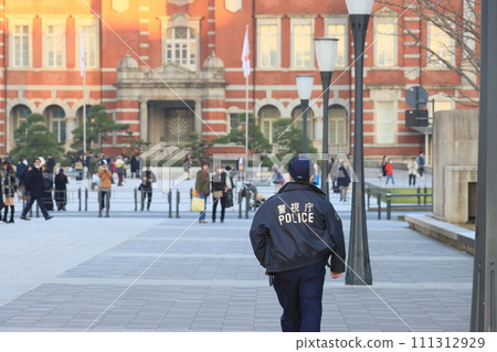 Police officers guarding the area around Tokyo Station; Metropolitan Police Department police officers 111312929