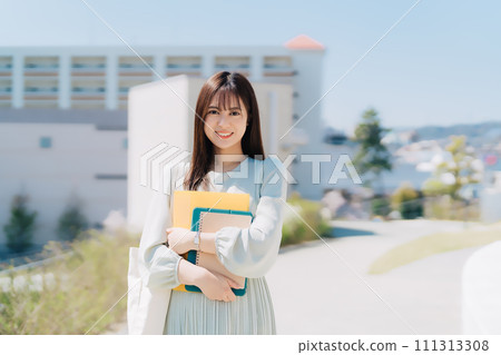 Female college student walking on campus 111313308