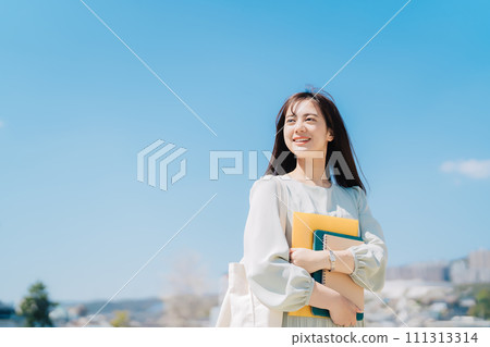 Blue sky and female college student 111313314