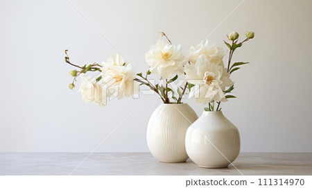 White Roses in Ceramic Vases on Marble 111314970