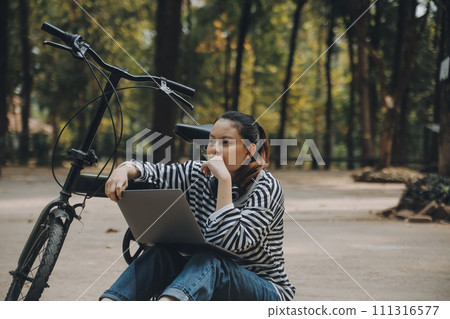 Happy Asian young woman walk and ride bicycle in park, street city her smiling using bike of transportation, ECO friendly, People lifestyle concept. Happy Asian young woman walk and ride bicycle in park, street city her smiling using bike of transportation, ECO friendly, People lifestyle concept. 111316577