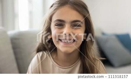 Happy Latin preteen child girl looking at camera, smiling, laughing 111318157