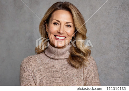 Beautiful gorgeous mature woman 40s looking at camera. portrait of an elegant woman in a knitted sweater on a gray background. Healthy facial skin care, middle aged skin care cosmetics, cosmetology 111319183