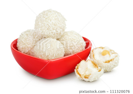 round candy raffaello with coconut flakes and nut in ceramic bowl isolated on white background round candy raffaello with coconut flakes and nut in ceramic bowl isolated on white background 111320076
