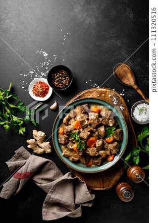 Beef meat goulash with carrot and onion, beef and carrot stew, top view Beef meat goulash with carrot and onion, beef and carrot stew, top view 111320516