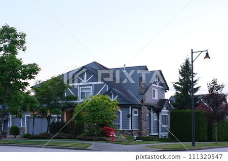Custom built big luxury house with triple garage doors in a residential neighborhood. Suburbs of Vancouver Surrey Canada. High quality Custom built big luxury house with triple garage doors in a residential neighborhood. Suburbs of Vancouver Surrey Canada. High quality 111320547