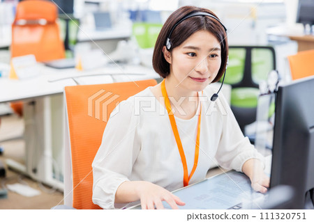 Call center operator receiving a call Call center operator receiving a call 111320751