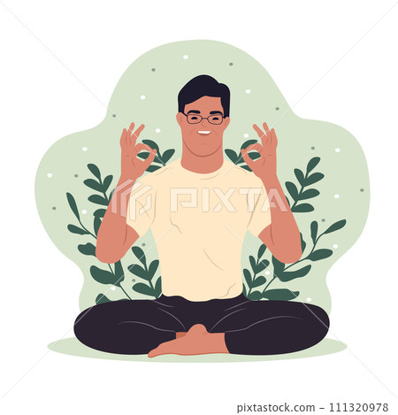 A young man with Down syndrome meditates during a yoga class. 111320978