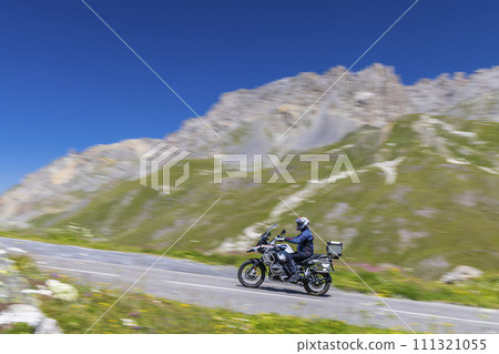 Motorbike on route des Grandes Alpes near Col du Galibier, Hautes-Alpes, France 111321055