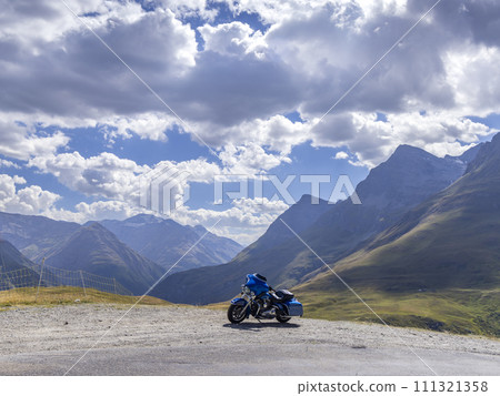 Motorbike on Route des Grandes Alpes near Col de l'Iseran, Savoy, France 111321358