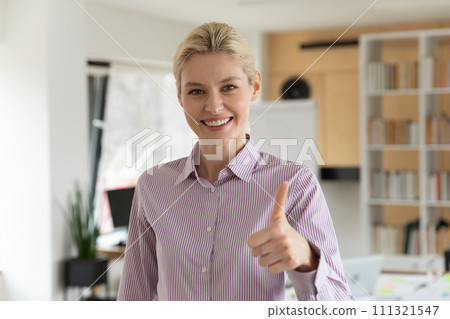 Portrait of smiling female client show thumb up 111321547