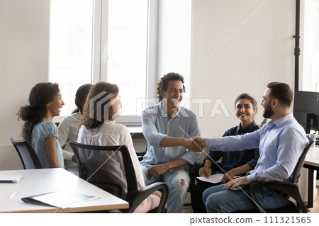 Cheerful confident business colleagues men shaking hands with recognition 111321565