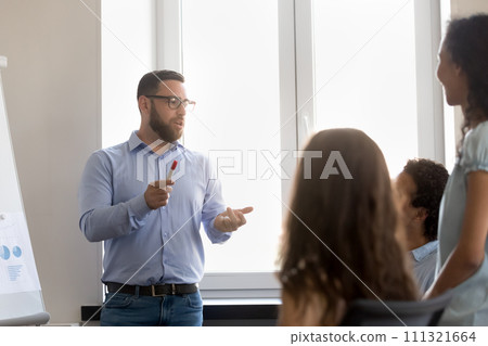 Serious confident busy project leader talking to employees 111321664