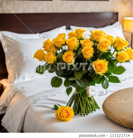 Bouquet of Yellow roses on the bed in a hotel room for honeymoon. romantic meeting of guests at the hotel. 111321714