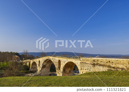 Pont Julien, roman stone arch bridge over Calavon river, Provence, France 111321821