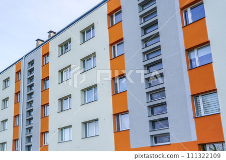 Renovated and thermally insulated facade of a typical 1970s apartment building Renovated and thermally insulated facade of a typical 1970s apartment building 111322109