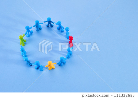 Diversity and inclusion concept. Colorful figurines on blue background Diversity and inclusion concept. Colorful figurines on blue background 111322683
