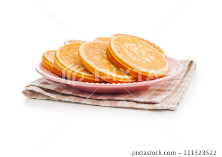 Tasty sweet pancakes on plate isolated on white background. 111323522