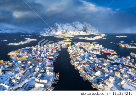 Aerial view of snowy fishing village in Norway in winter 111324212