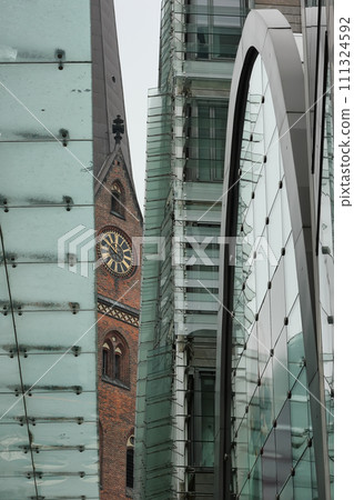 St. Peters church in Hamburg and elements of a modern building. St. Peters church in Hamburg and elements of a modern building. 111324592