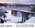 A bridge connecting the snow-covered opposite shore-Generative AI 111325306