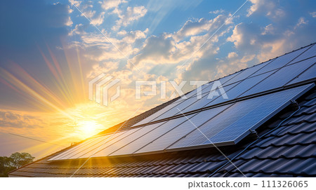Solar energy panels on a house roof capture the last rays of the sun at dusk, symbolizing sustainable power solutions. Solar energy panels on a house roof capture the last rays of the sun at dusk, symbolizing sustainable power solutions. 111326065