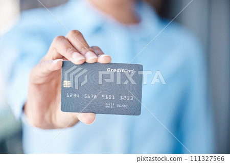Finance, savings and a credit card in hand, woman with financial freedom blurred in background. Banking, overdraft and a budget for retail or online shopping. Investment, payment and access to money. 111327566