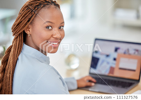 Black woman, designer and manager on laptop planning and working with business email, SEO research and contact us website. Portrait of african employee working online on website or logo design 111327576