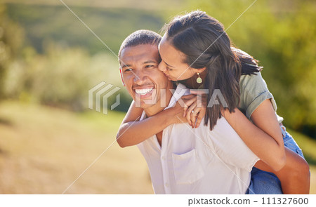 Love, date and outdoor couple in park playing on holiday, vacation or healthy lifestyle with green trees, bokeh and summer sun. Happy, wellness black people piggyback ride together or nature hiking 111327600