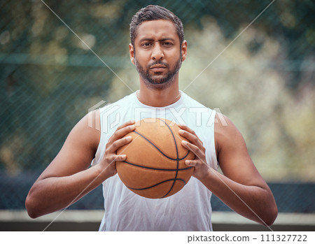 Basketball court, man and serious portrait with ball in outdoor sports venue for practice. Competitive, strong and mature athlete male thinking of a game play strategy for outside match. 111327722