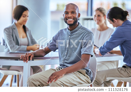 Portrait of a happy businessman smile in a team planning meeting at work. A proud employee in an office with group as they discuss new innovative plans, idea and strategy in a corporate office 111328176