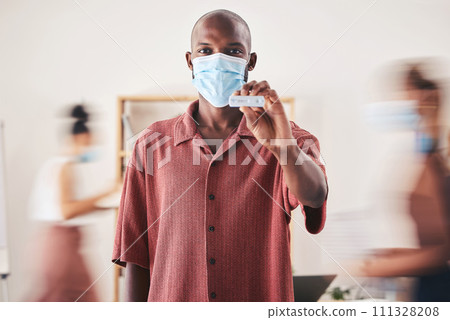 Covid, rapid antigen test and face mask while standing and showing negative medical results. Portrait of a black man looking happy after coronavirus health screening during pandemic at his workplace 111328208